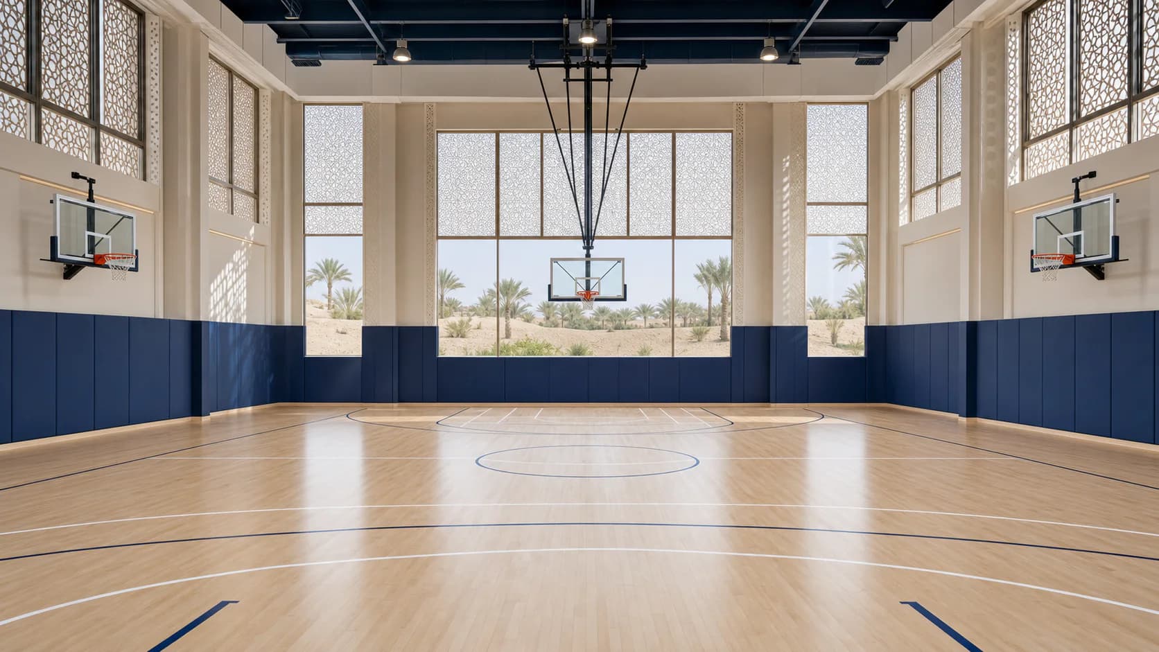 Modern indoor basketball court with UAE-inspired screening and daylight in Dubai